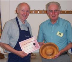 The monthly winner Denis Ireland receiving his certificate from Reg Slack
